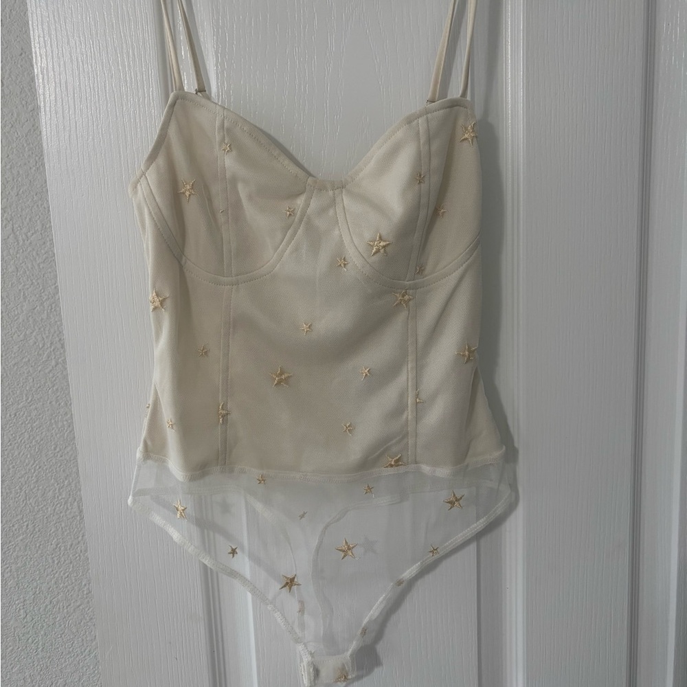 Elegant Cream Bodysuit with Gold Star Accents